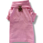 Pink dog shirt with a teddy bear on a white background