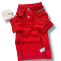 Red dog pet polo shirt with collar and tag on a white background