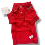 Red dog pet polo shirt with collar and tag on a white background