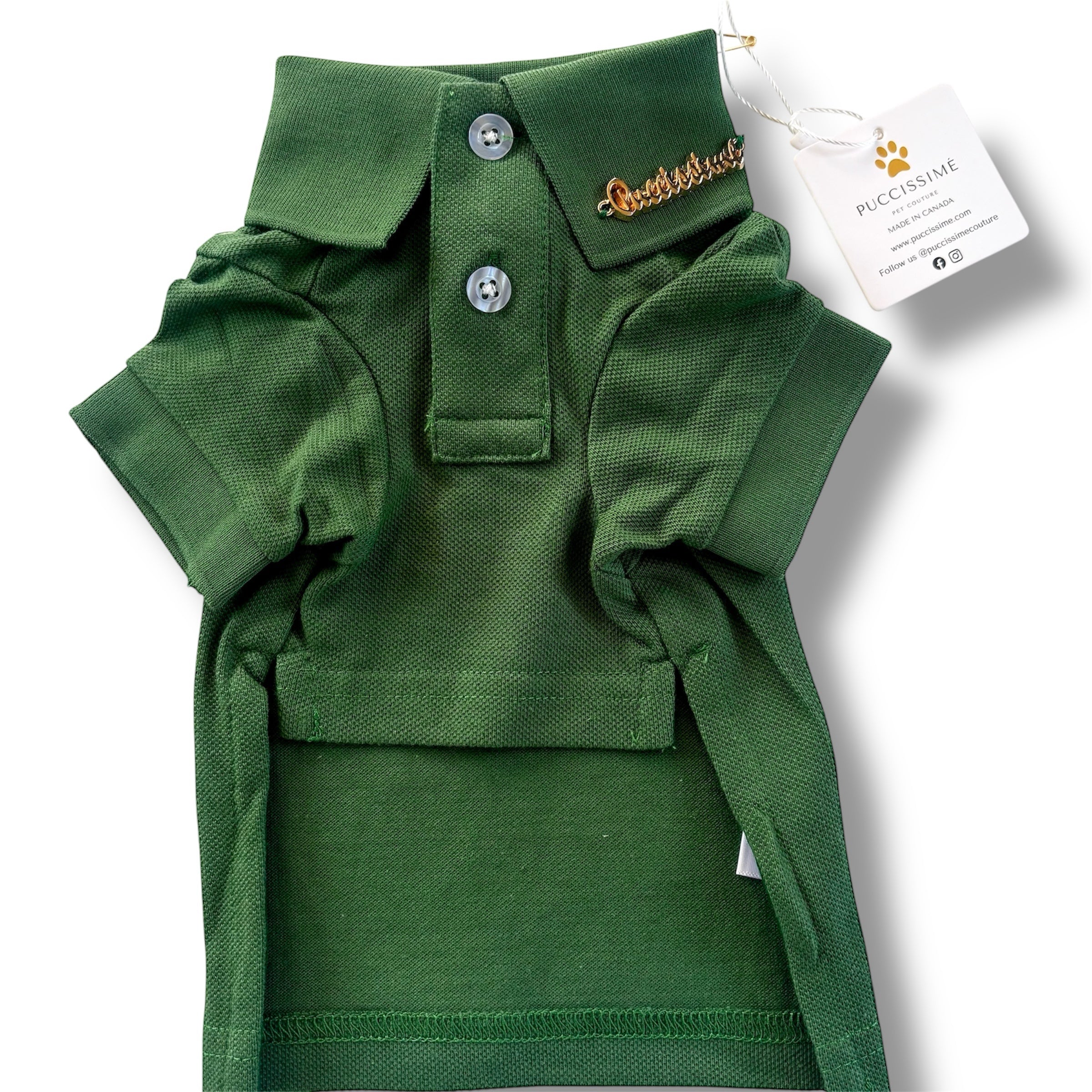 Green dog polo shirt with a brand tag on a white background