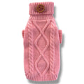 Pink knitted dog sweater with a brown button on a white background