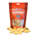 Bag of soft pumpkin training treats with treats spilling out on a white background