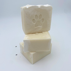Three blocks of soap with a paw print design on a white background