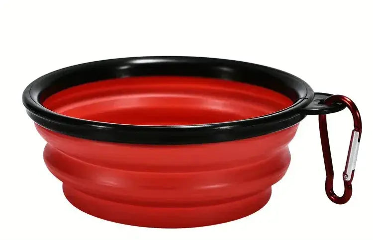 Red and black collapsible bowl with a carabiner on a white background