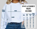 Person wearing a white sweatshirt with a size guide overlay
