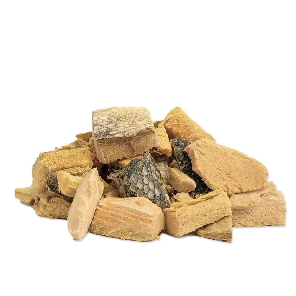A pile of dog treats isolated on a white background.