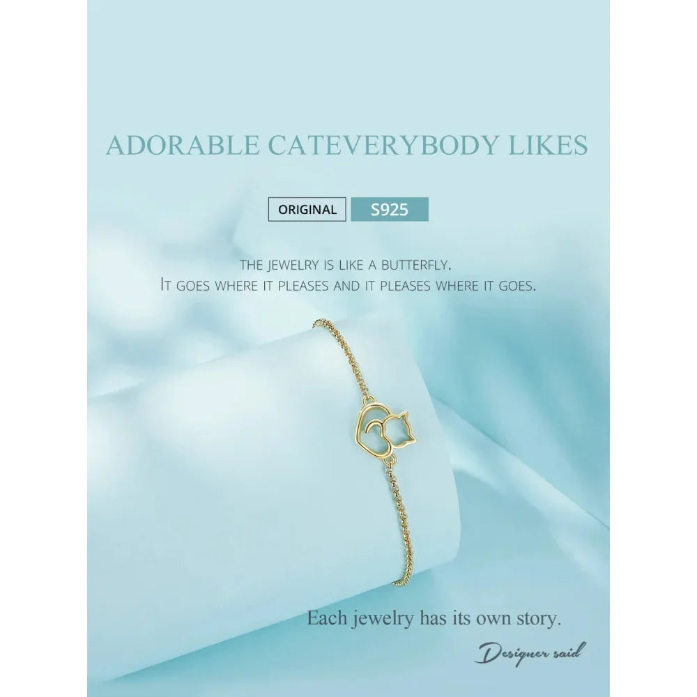 Gold bracelet with heart design on a light blue background, featuring text about jewelry design.