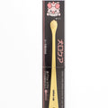 Dog toothbrush with packaging featuring a cartoon dog face on a white background
