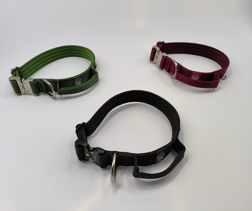 Three dog collars in green, black, and red on a white background