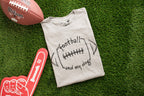 Gray t-shirt with 'football and my dog' design on grass with Wilson football and foam finger.