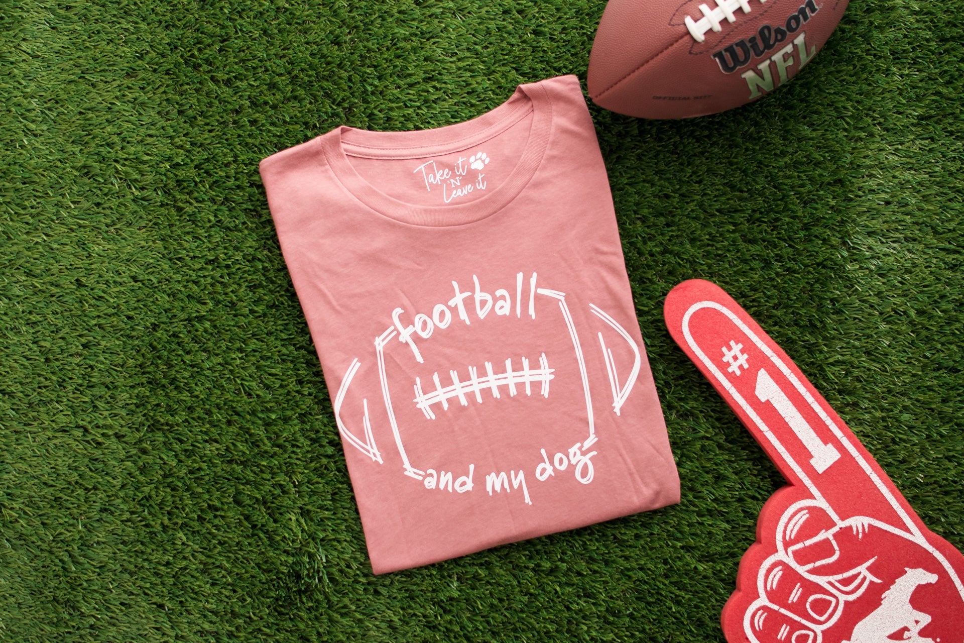 Pink t-shirt with football and my dog text on grass with football and foam finger