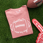 Pink t-shirt with 'football and my dog' text on grass with football and foam finger