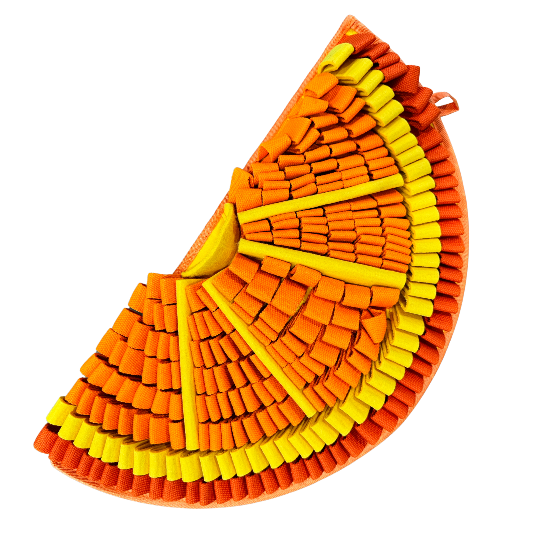 Colorful woven leaf-shaped object with orange and yellow patterns on a white background
