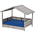 Rattan outdoor daybed with canopy and blue cushion on a white background
