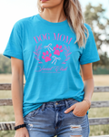 Person wearing a blue t-shirt with 'Dog Mom Social Club' design outdoors.