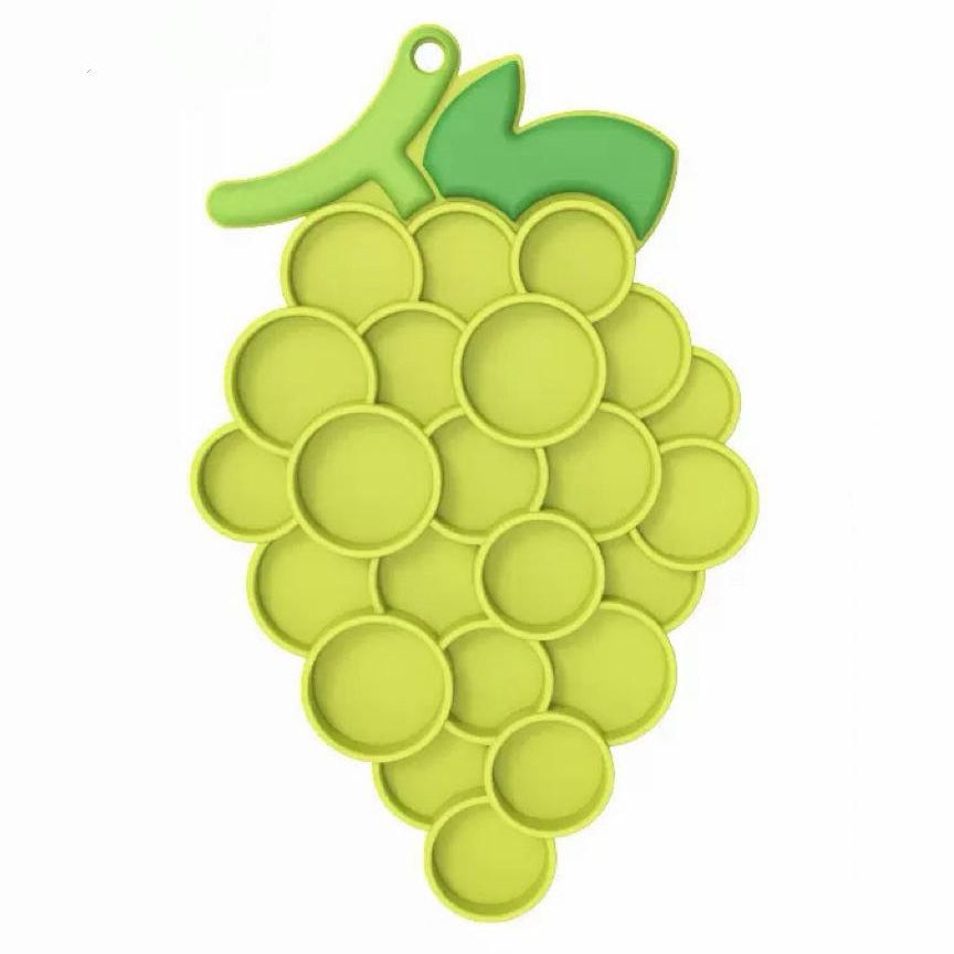 Green pet lick mat shaped like a bunch of grapes on a white background