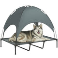 Dog lying on a gray pet canopy bed with a white background