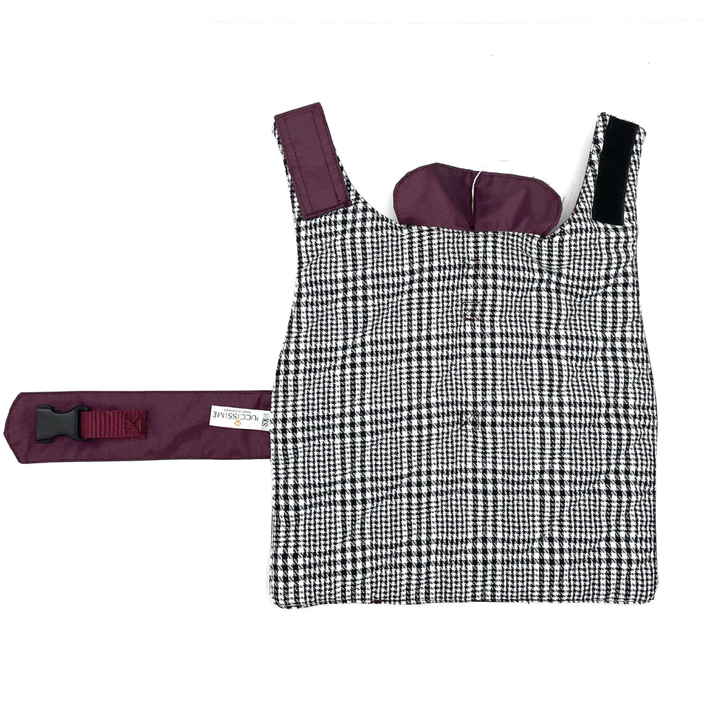 Black and white checkered dog rain coat on a white background