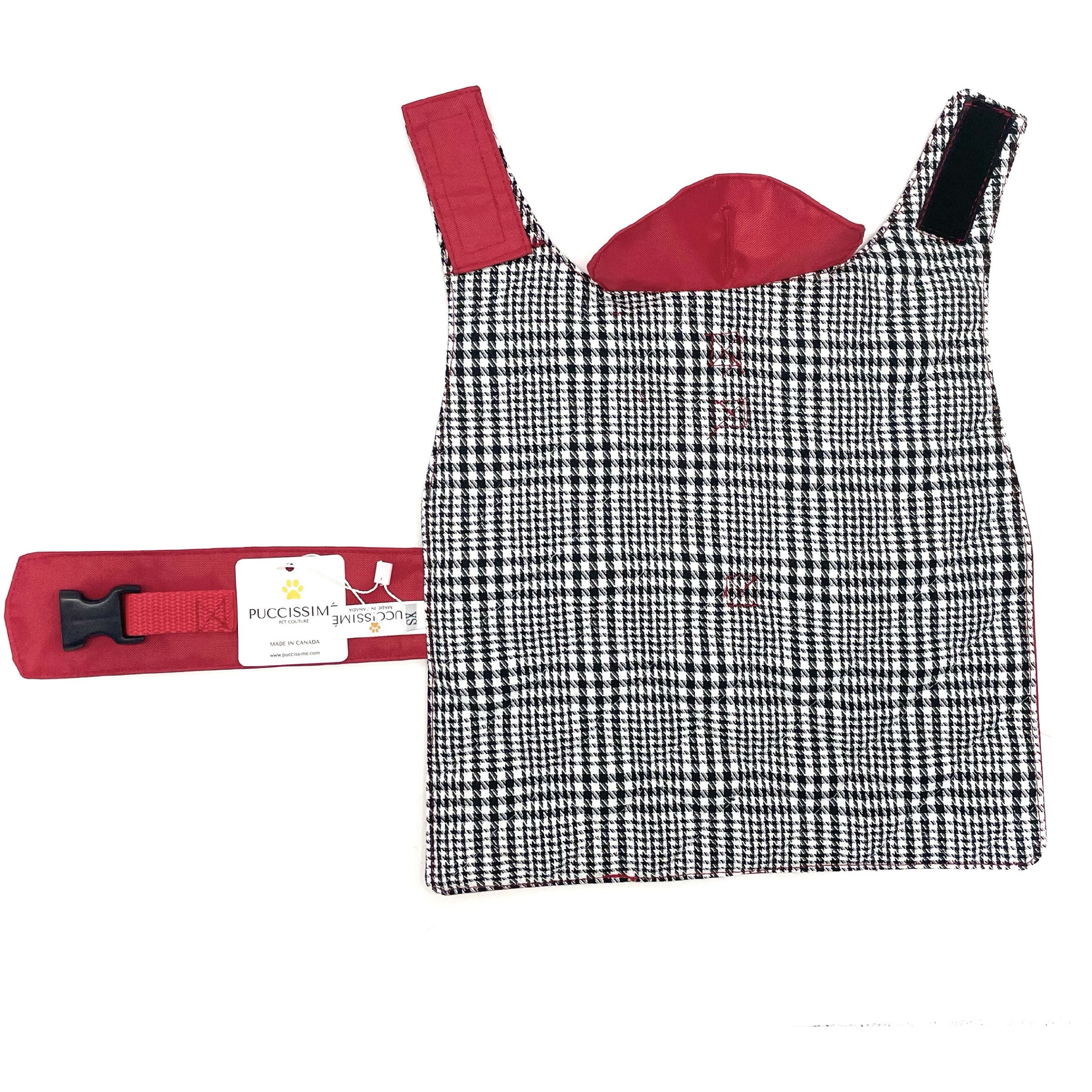 Black and white checkered dog coat with red straps on a white background
