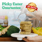 Product with a 'Picky Eater Guarantee' and '30 Days Money Back Guarantee' on a table with vegetables.