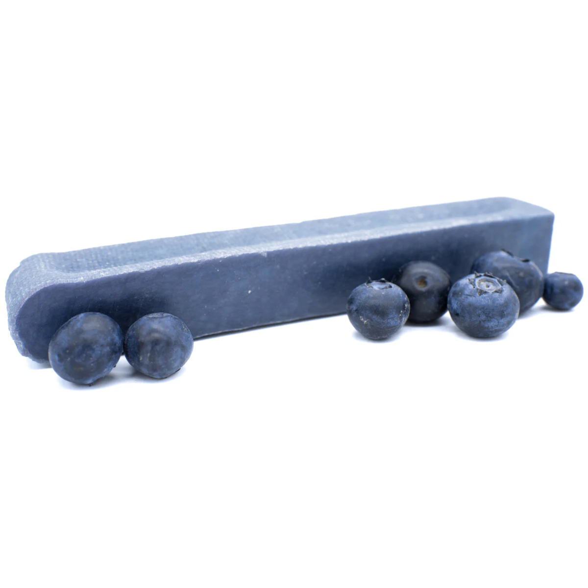 Blue yak chew with blueberries on a white background