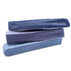 Three blue yak chew stacked on a white background