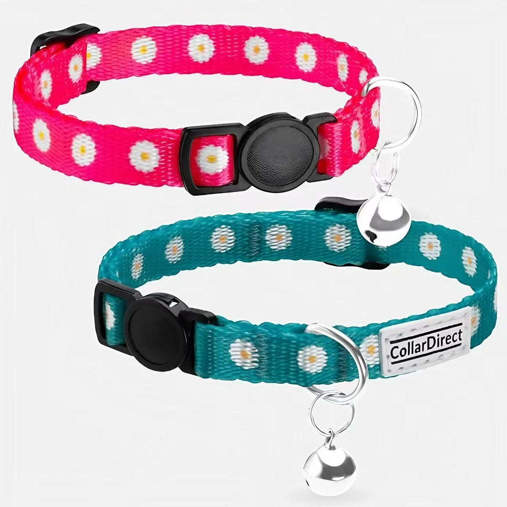 Two cat collars with daisy pattern, one pink and one teal, on a white background.