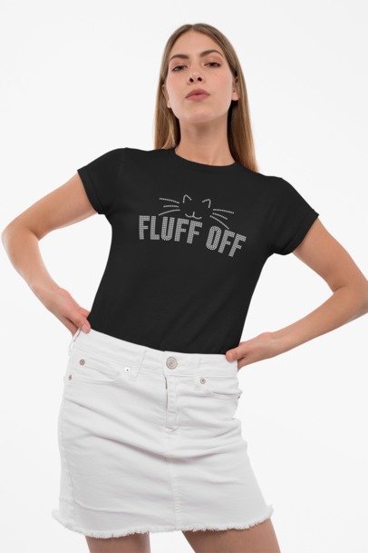 Woman wearing a black t-shirt with 'FLUFF OFF' text and a white skirt on a white background