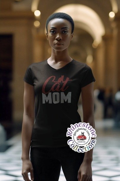 Woman wearing a black t-shirt with 'Cat Mom' text in an indoor setting.