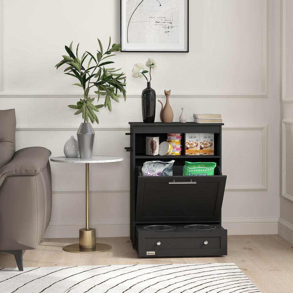 Black pet food storage cabinet in a living room setting with a plant and small table.