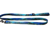 Blue and green mountain-patterned dog leash on a white background