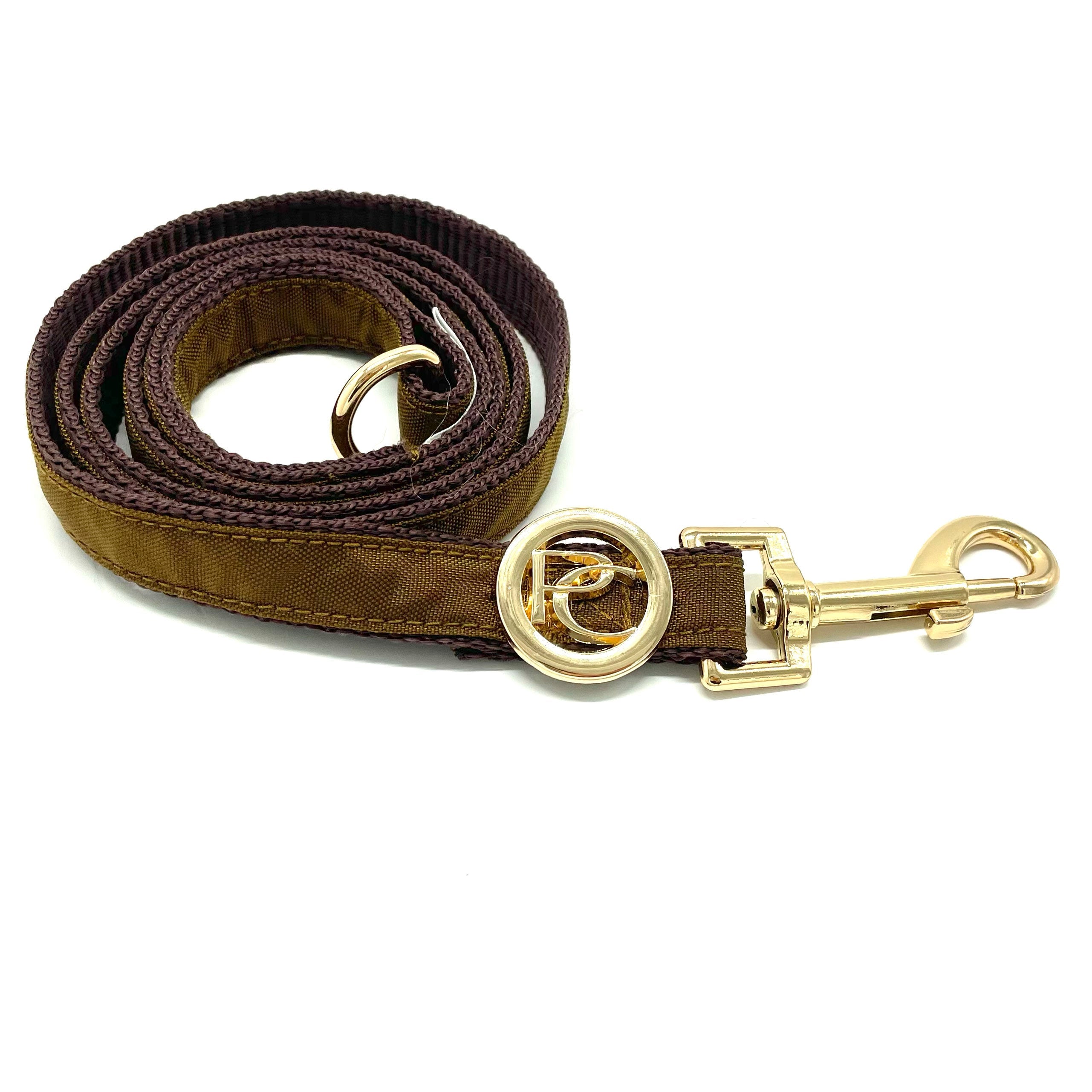 Gold dog leash with gold clasp on a white background