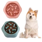 Pink and green silicone pet treat mold with a dog sitting next to it on a white background