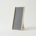 Gray felt cat scratcher on a white background