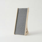 Gray felt cat scratcher on a white background
