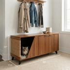 Wooden cabinet with a cat shelter and coats hanging above in a room.