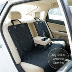 Car seat cover with adjustable armrest opening installed in a vehicle.