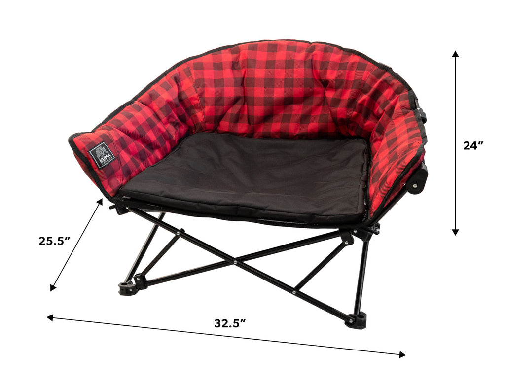 A camping chair with a red and black buffalo plaid fabric interior and a black seat cushion on a black folding frame, shown with dimension arrows and labels indicating 32.5 inches wide, 25.