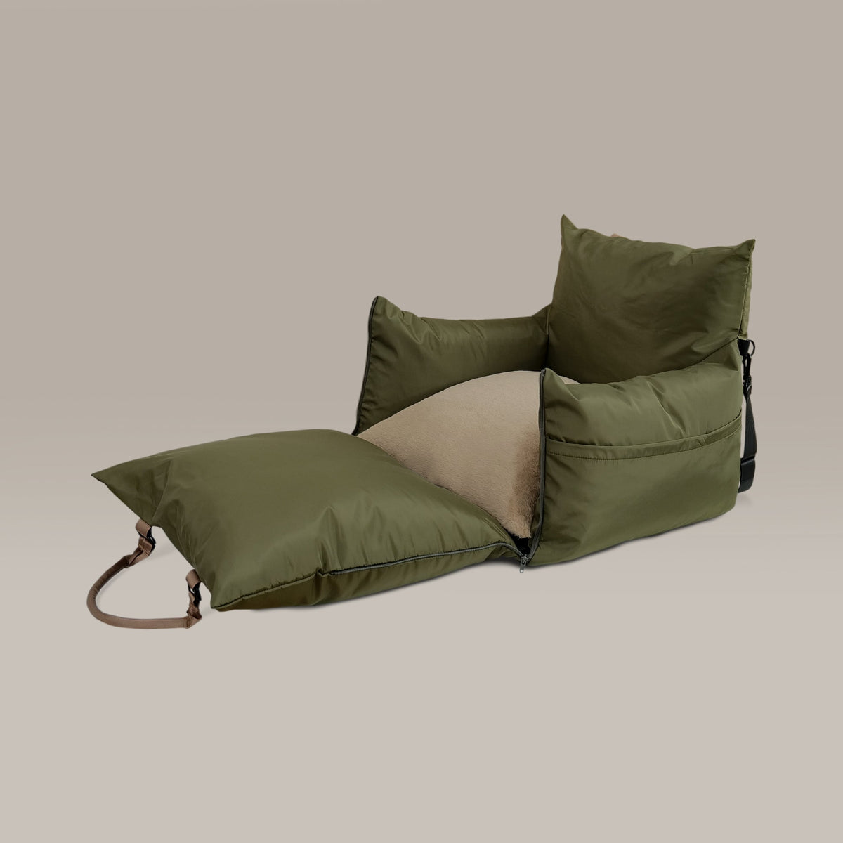 Green pet car seat on a beige background