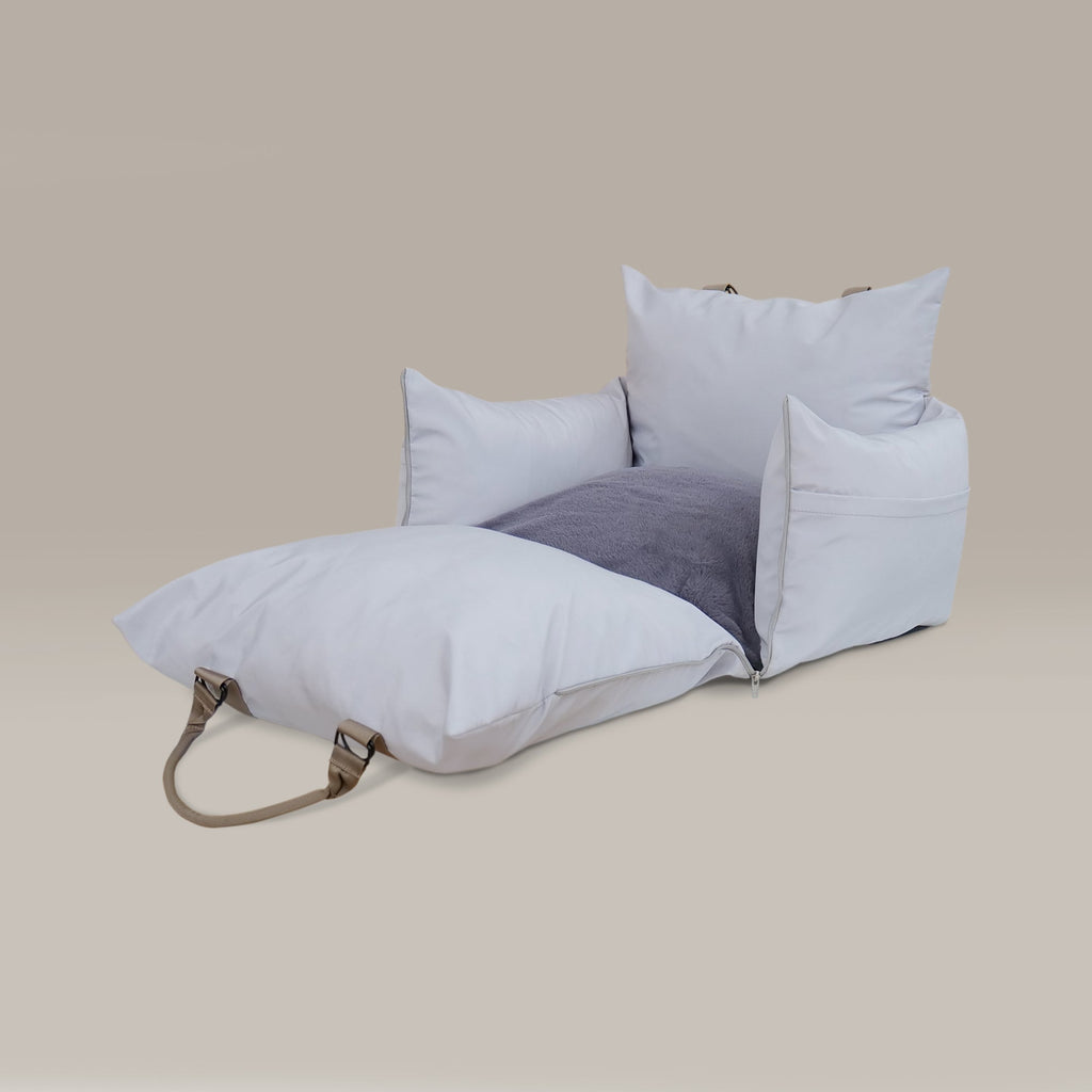 Pet car seat with a strap on a beige background
