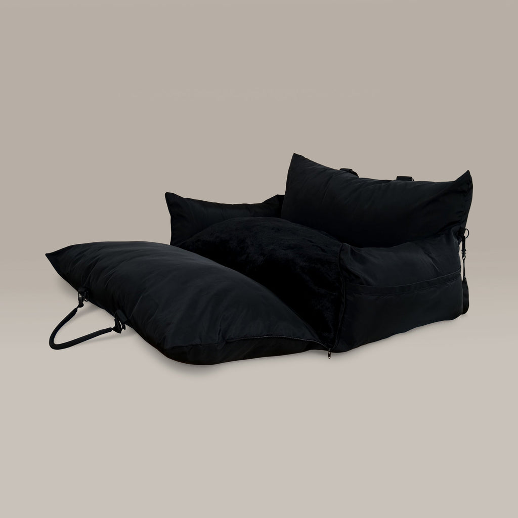 Black pet car seat on a beige background