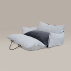 White pet car seat on a beige background
