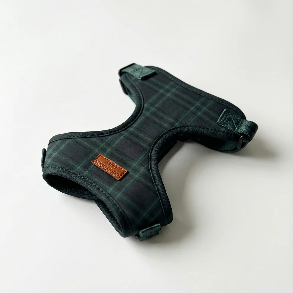Green plaid dog harness on a white background