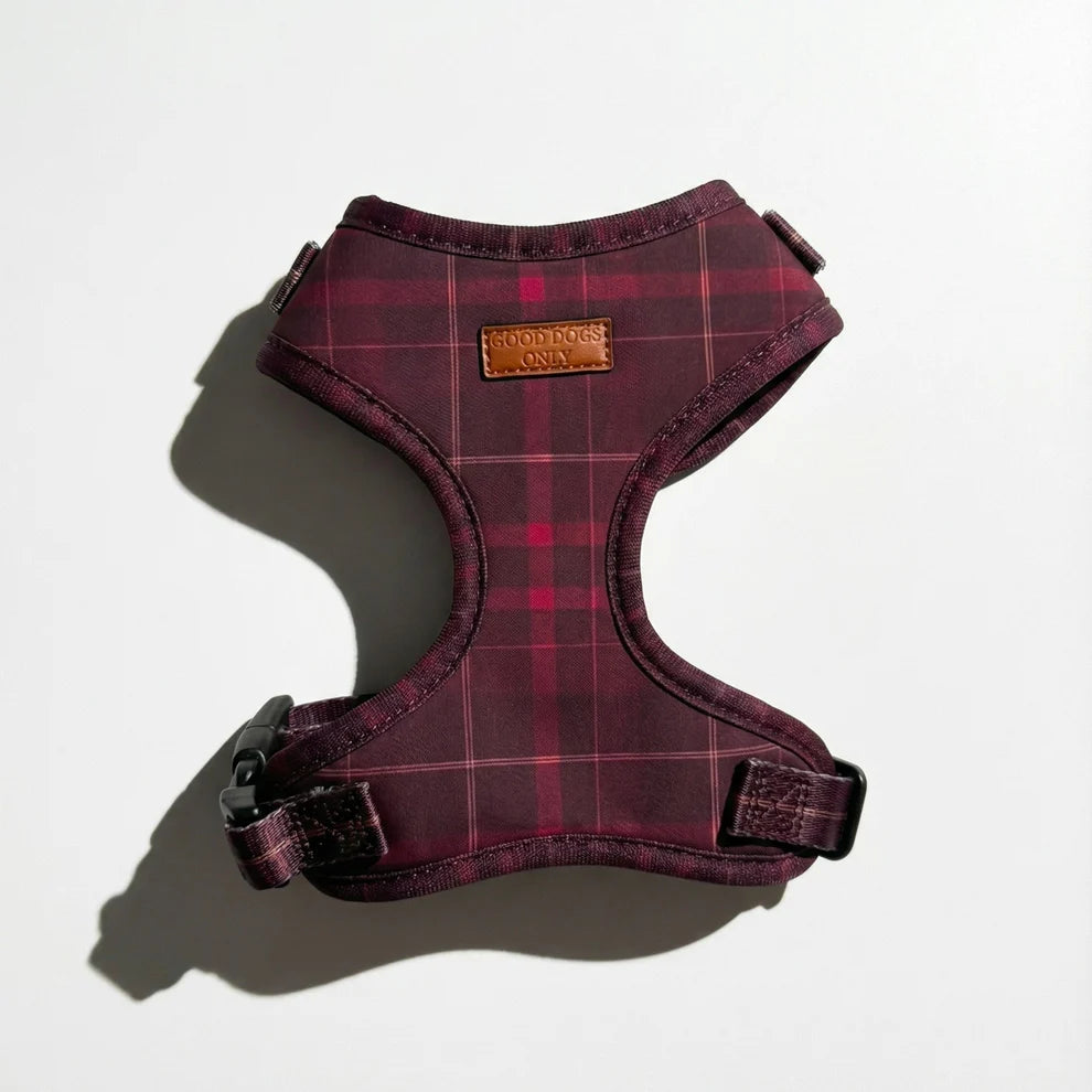 Red plaid dog harness on a light gray background