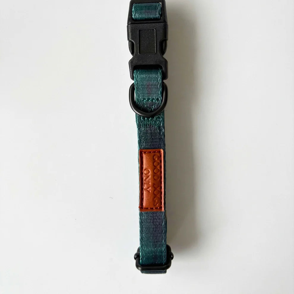 Dog collar with a brown leather patch on a white background
