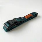 Green dog collar with a brown leather patch on a white background