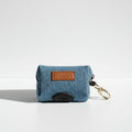 Denim waste bag holder with a leather tag and keychain on a white background