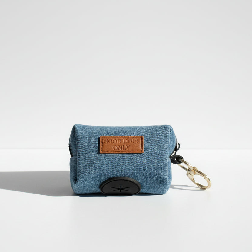 Denim waste bag holder with a leather tag and keychain on a white background
