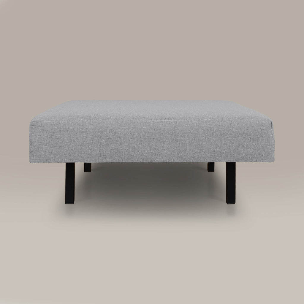 Gray upholstered ottoman on a beige background