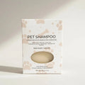 Pet shampoo bar soap packaging with paw prints on a light background